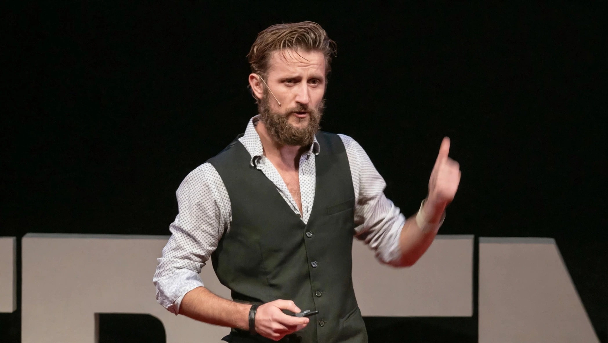 Zachary Moses speaking on the TEDx stage